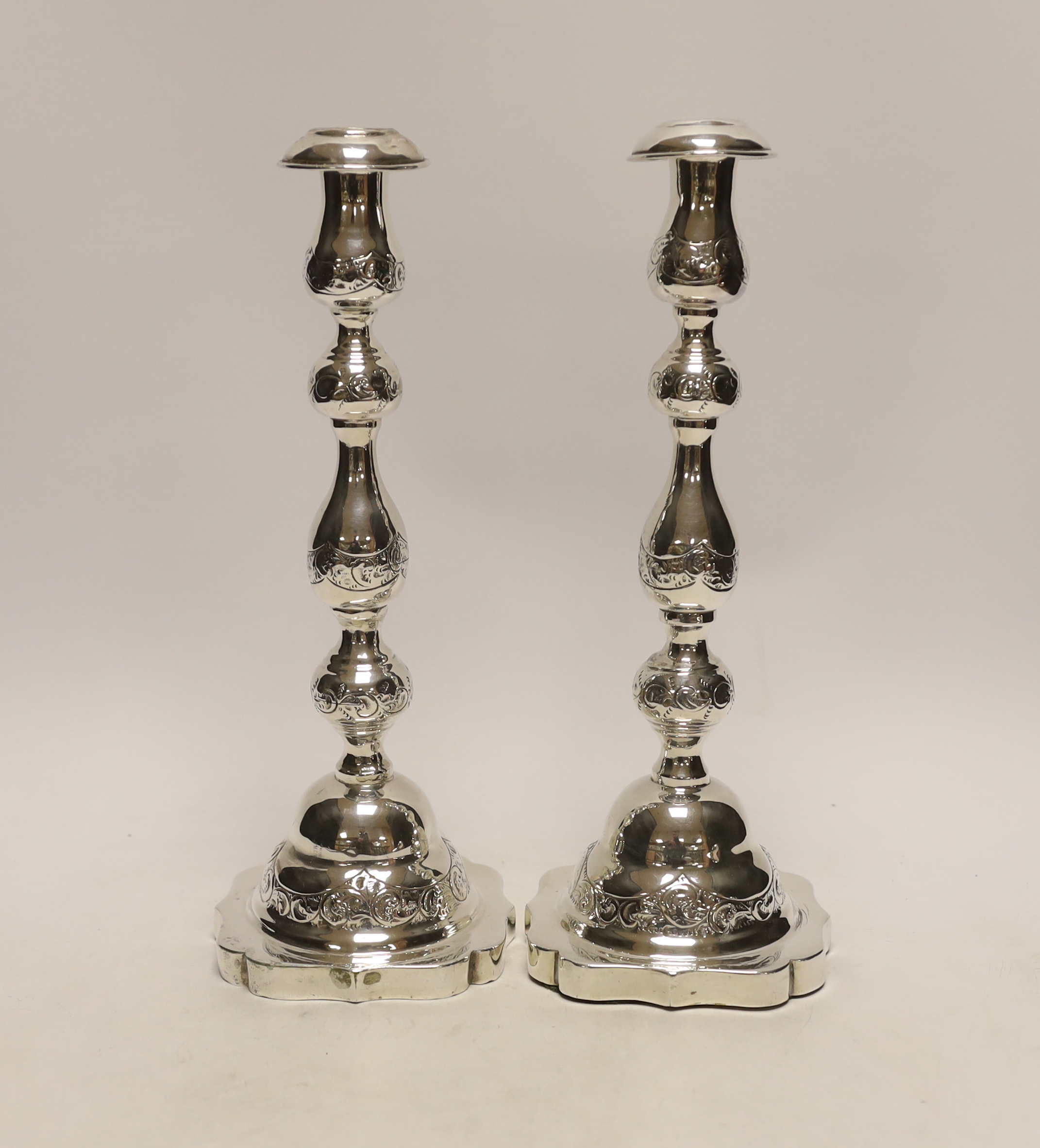 A pair of George V silver Sabbath candlesticks, by Rosenzweig, Taitelbaum & Co, London, circa 1925, marks rubbed, height 29.4cm, weighted.